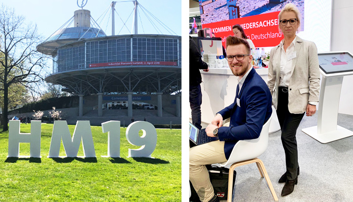 #HM19 Zeichen auf dem Messegelände Hannover und das ABAKUS-Messeteam der #HM19 Ulrike Di Carlo und Phillip Hauschild